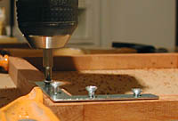 Use a drill or screw in the brackets